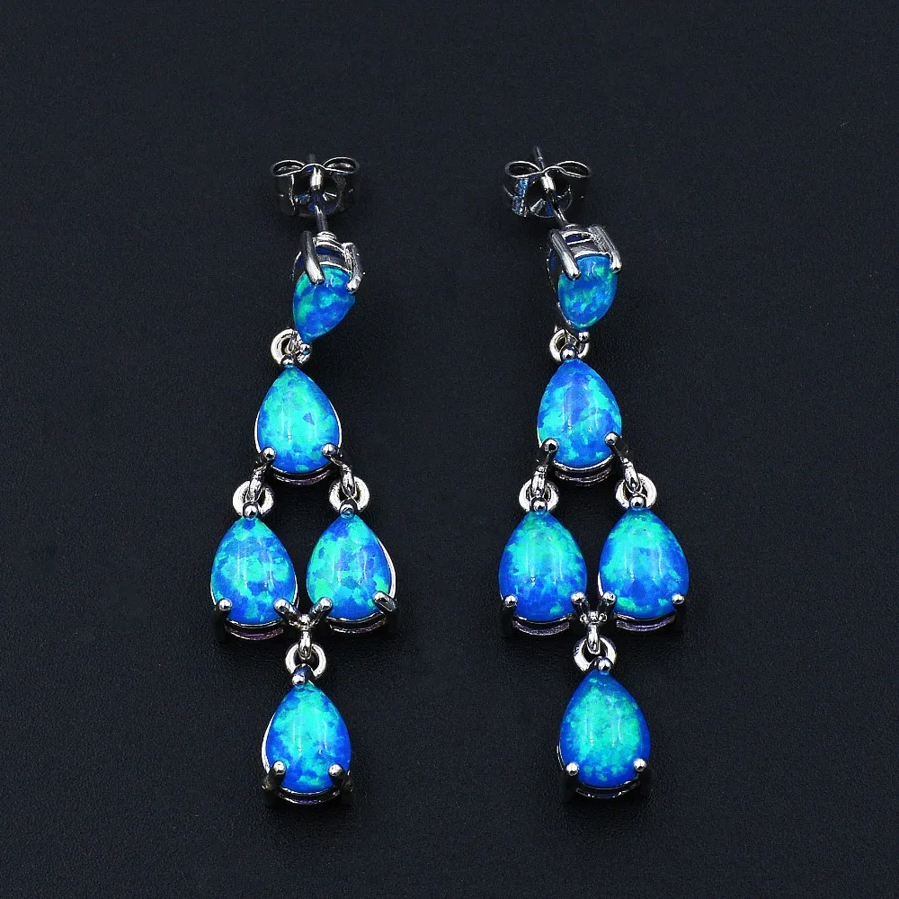 

Ocean Blue Fire Opal Earrings with Butterfly Fastening