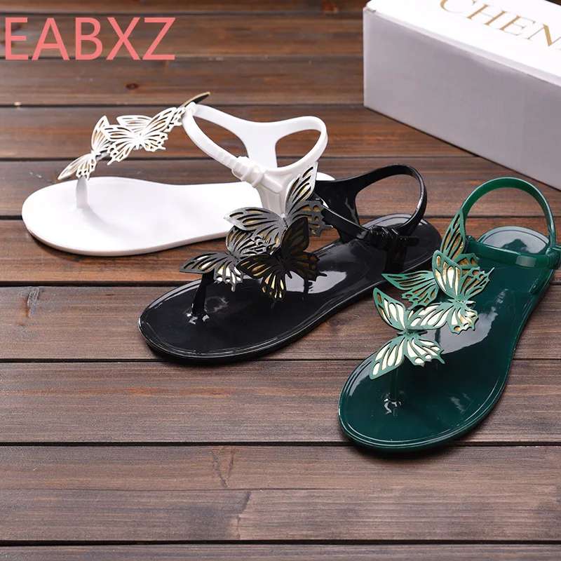 

EABXZ European and American royal family summer new crystal jelly sweet bow decorated flat bottom character pin female sandals