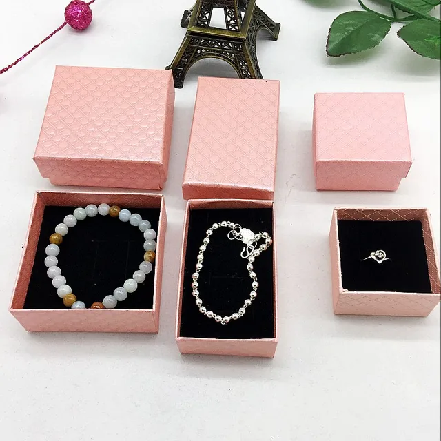 Two pink jewelry boxes, wholesale diamond bracelets, necklaces, rings