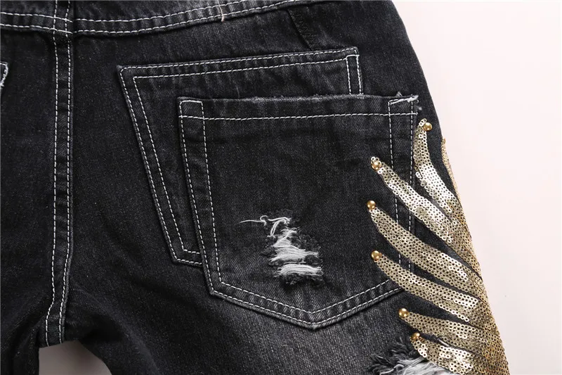 Goldene Pailletten Herren Jeans männlich Eagle Wings Stickerei Nähte Pailletten Löcher Jeans dünne Hose zerrissene schwarze Hose der Herren Goldene Pailletten Herren Jeans männlich Eagle Wings Stickerei Nähte Pailletten Löcher Jeans dünne Hose zerrissene schwarze Hose der Herren