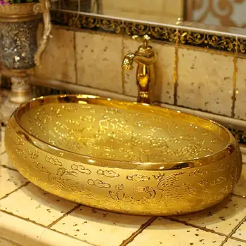 

Luxurious Embossed Golden Jingdezhen art counter top wash basin lavabo carving oval sink ceramic wash basin Bathroom sink
