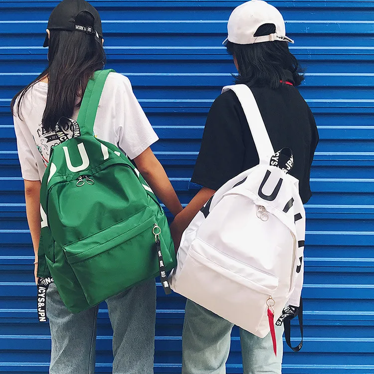 

2017 new Fashion student letter ribbon nylon ultra-light backbag large capacity leisure pure color female backpack
