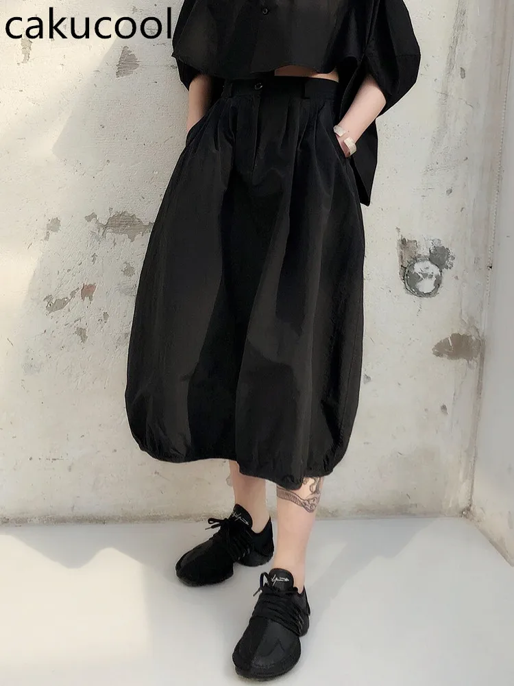 

Cakucool New Women skirts irregular black high waist cotton skirt women black solid color casual loose puls size