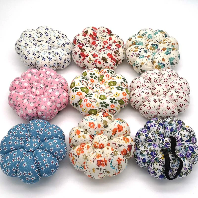 

Cross Stitch Needle Sewing Pin Cushion Button Wrist Strap Holder for Stitch Sewing Needlework Accessory Random Color