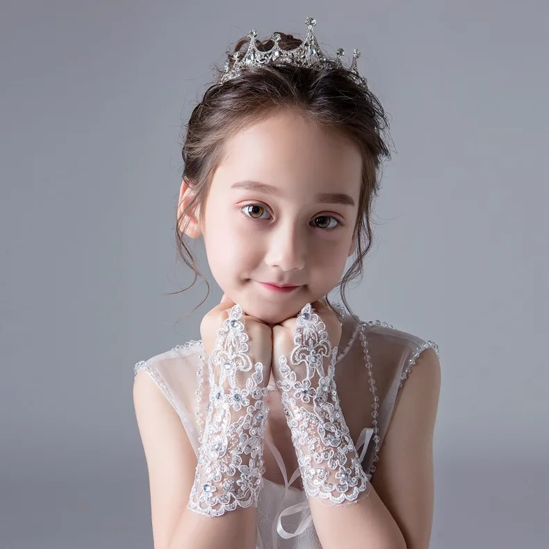 

Lace and diamond-encrusted children's dress gloves and fingerless girl's dance gloves