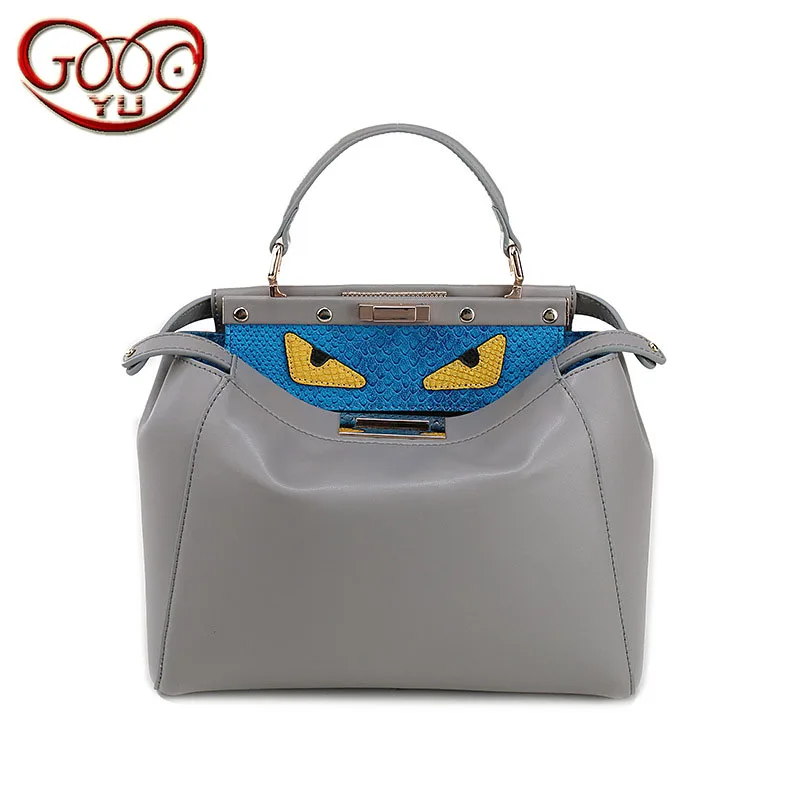 

New fashion leather handbags Europe and the United States explosion models portable diagonal kitten shoulder monster cartoon pac
