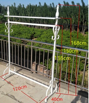 Wrought iron clothing store display shelf. Console clothes rack. Clothing racks display shelf.