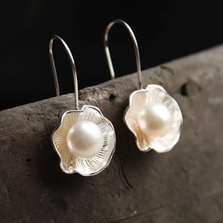 

Luxury shell-shaped earrings Thai silver temperament ladies fashion popular high-end jewelry handmade crafts simple OL