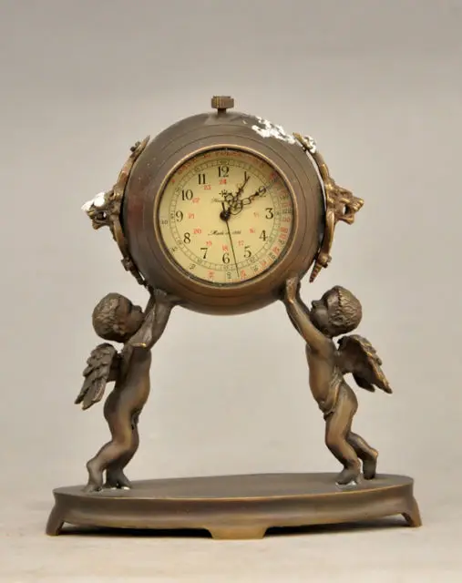 

Elaborate Chinese Collectible Decorated Old Copper Carved Two Angels Hold Mechanical Table Clock