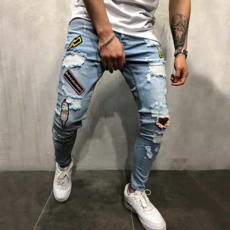 

Male badge embroidery Knee holes Hip Hop Ripped Skinny biker Jeans Men streetwear Destroyed Patch Stretch denim Joggers pants