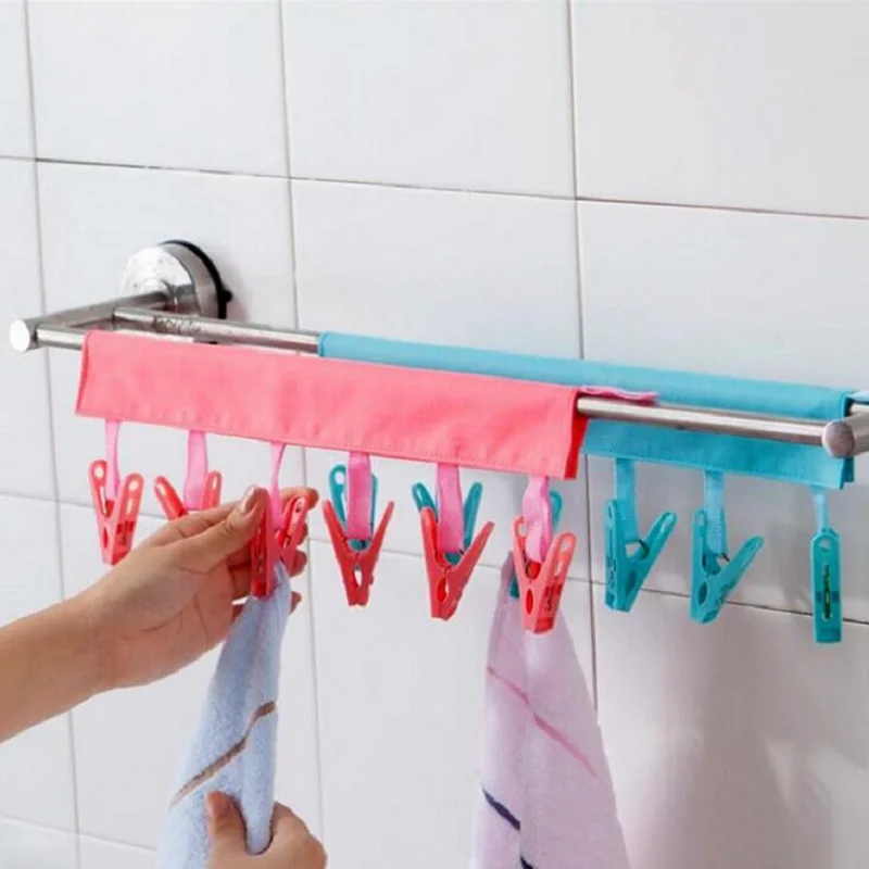 

Wholesale Multifunction Traveling Cloth portable hanger Folding clothespins Bathroom hanger Black/Fuchsia/Pink/Blue Color