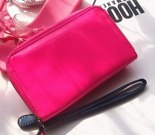 neon pink patent clutch bag