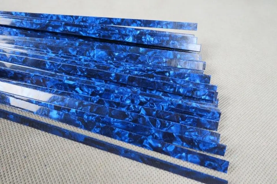 

10STRIPS BLUE PEARL CELLULOID BINDING,Measures7mm x1.5mm thick and1600mm long