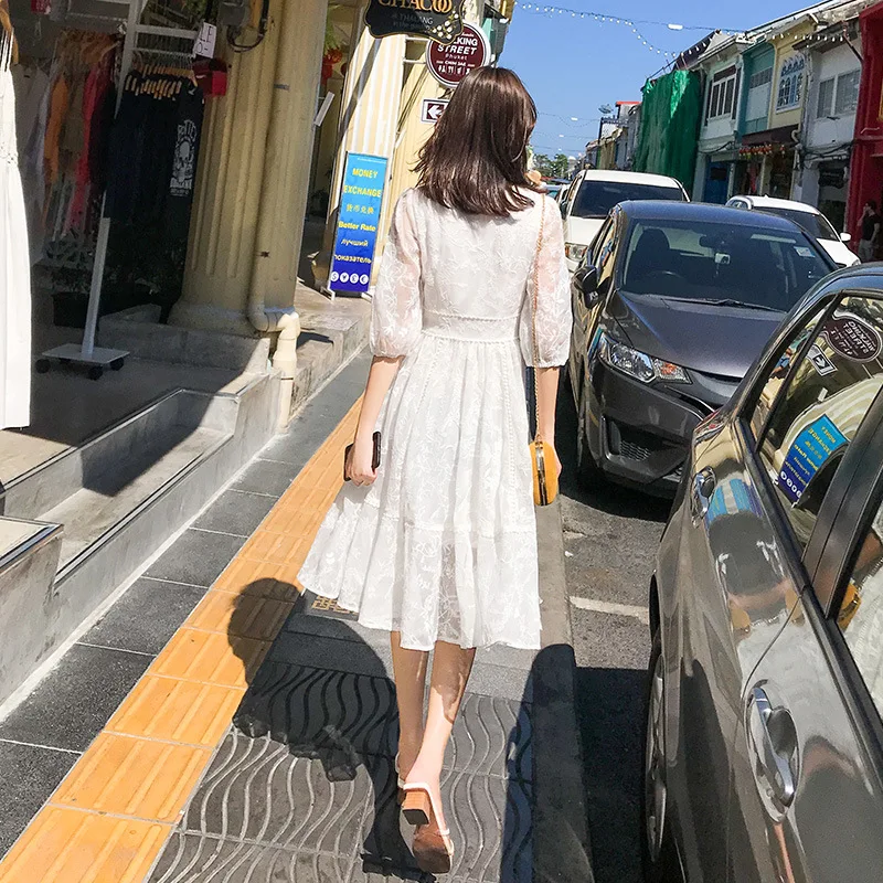 

A Long Fairy Dress In a White Lace Skirt In Summer