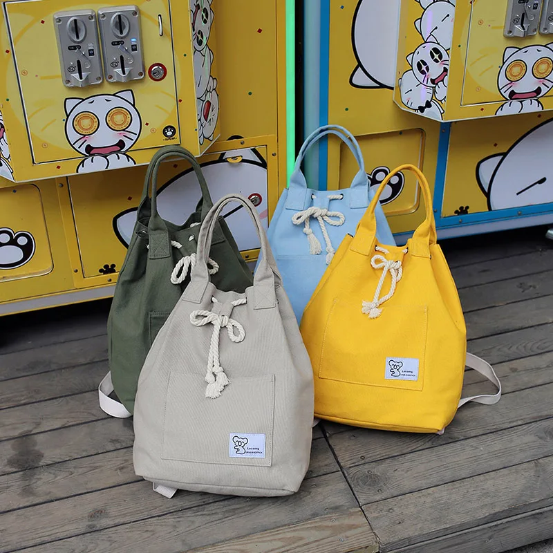 

mylb Canvas multi - purpose backpack leisure fashion student backpack drawstring buckle solid - color large - capacity backpack