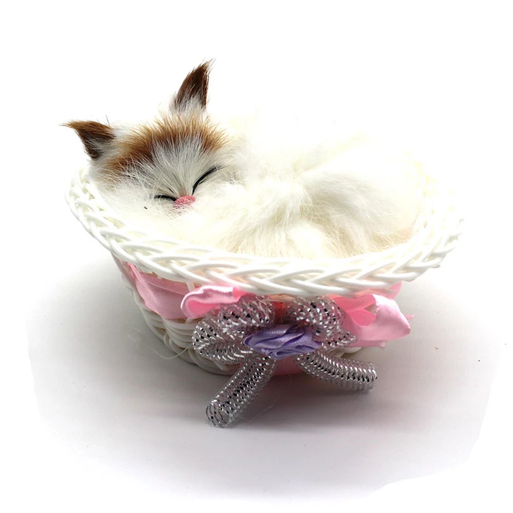 sleeping cat in basket toy