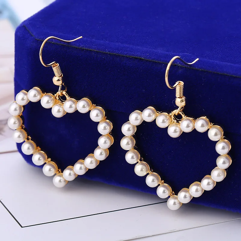 

Korean style Japanese style sweet pearl earrings female lovely heart hollow heart heart pendant ear hook new style