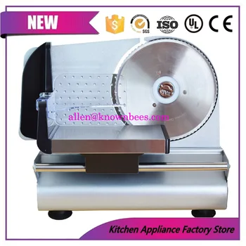 

Small commercial toast with slices of bread and lemon slices of frozen meat and meat slicing machine