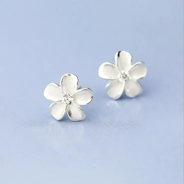 

SMJEL New Fashion Sliver Color Flower Stud Earrings for Women Tiny Cherry Blossom Earring Jewelry Brincos Party Gifts SYED138
