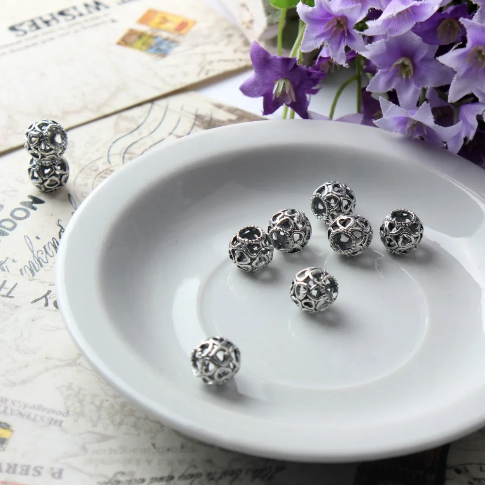 Wholesale alloy hollow heart shaped bead for DIY fits European charms