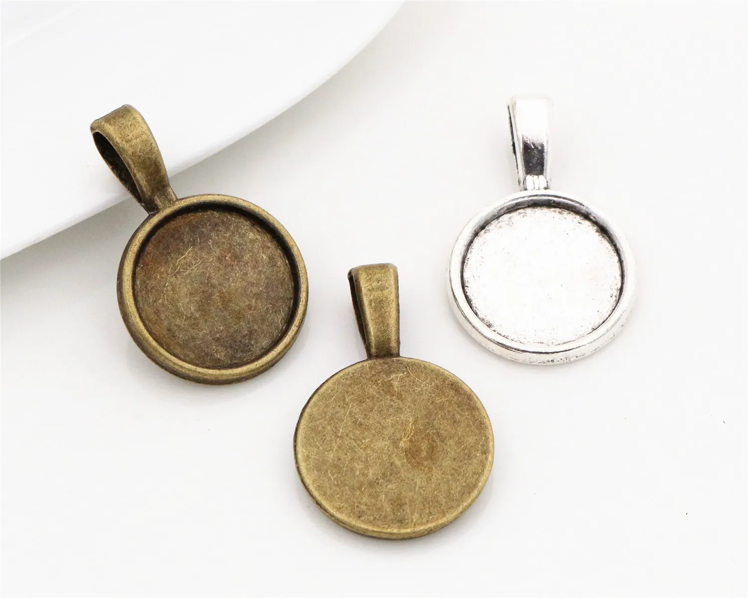 

15pcs 14mm Inner Size Antique Bronze And Silver hanging head Style Cabochon Base Cameo Setting Charms Pendant
