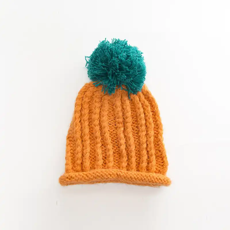 beanie hat with large pom pom