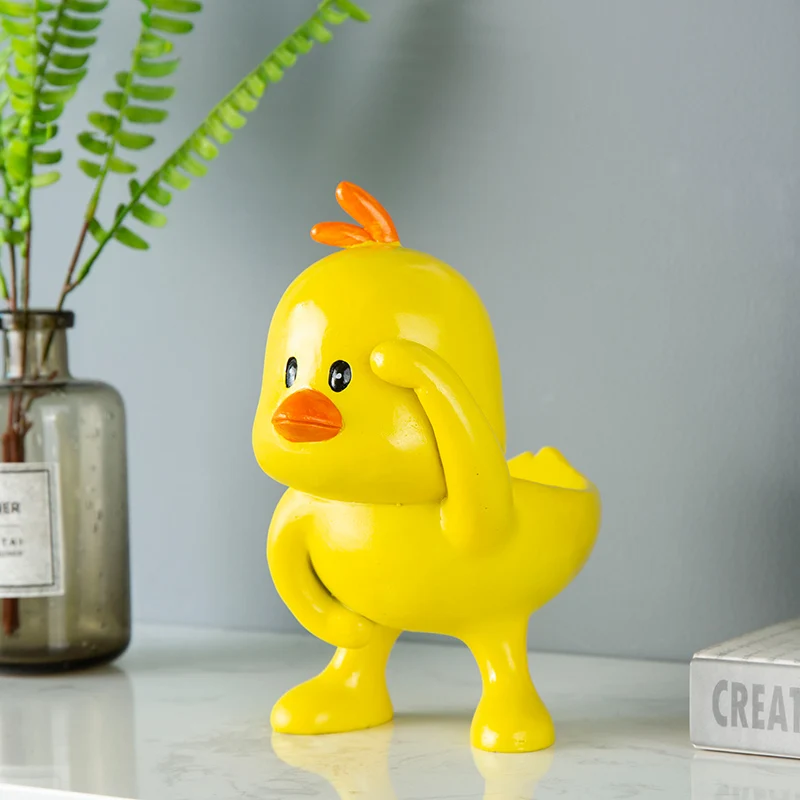 

Fun yellow cartoon duckling resin storage box Cute duck desktop decorative sculpture storage holder