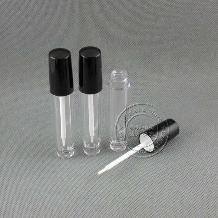 Lip gloss containers with brush applicator