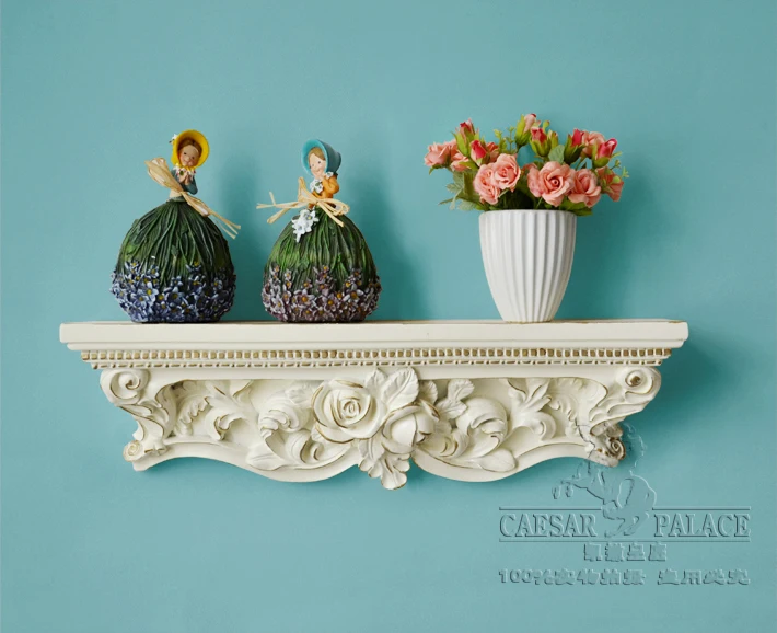 A word shelf/partition of carve patterns or designs on woodwork shelf. Hanging bracket.