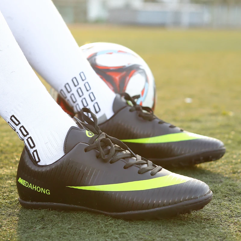 turf soccer shoes on grass