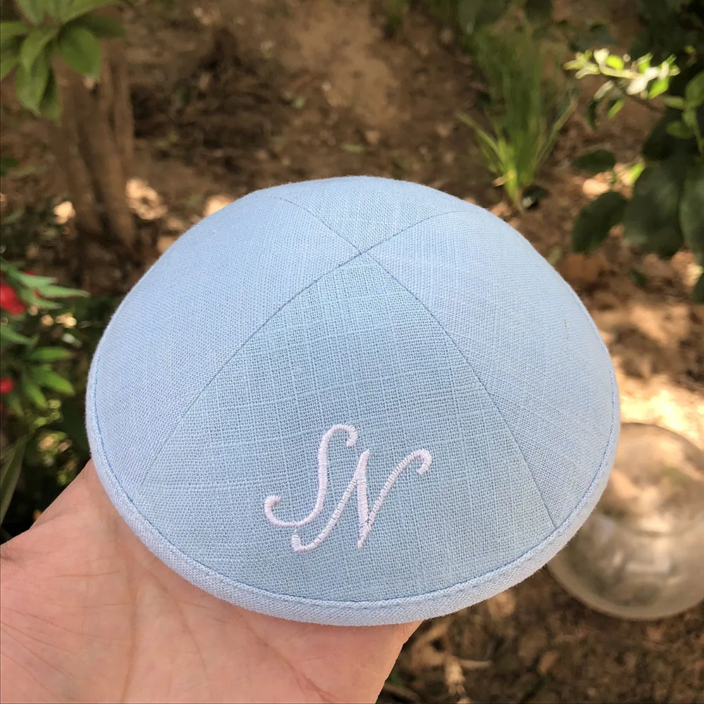 

BABY BLUE LINEN KIPAS WITH WITHE EMBROIDERY LOGO