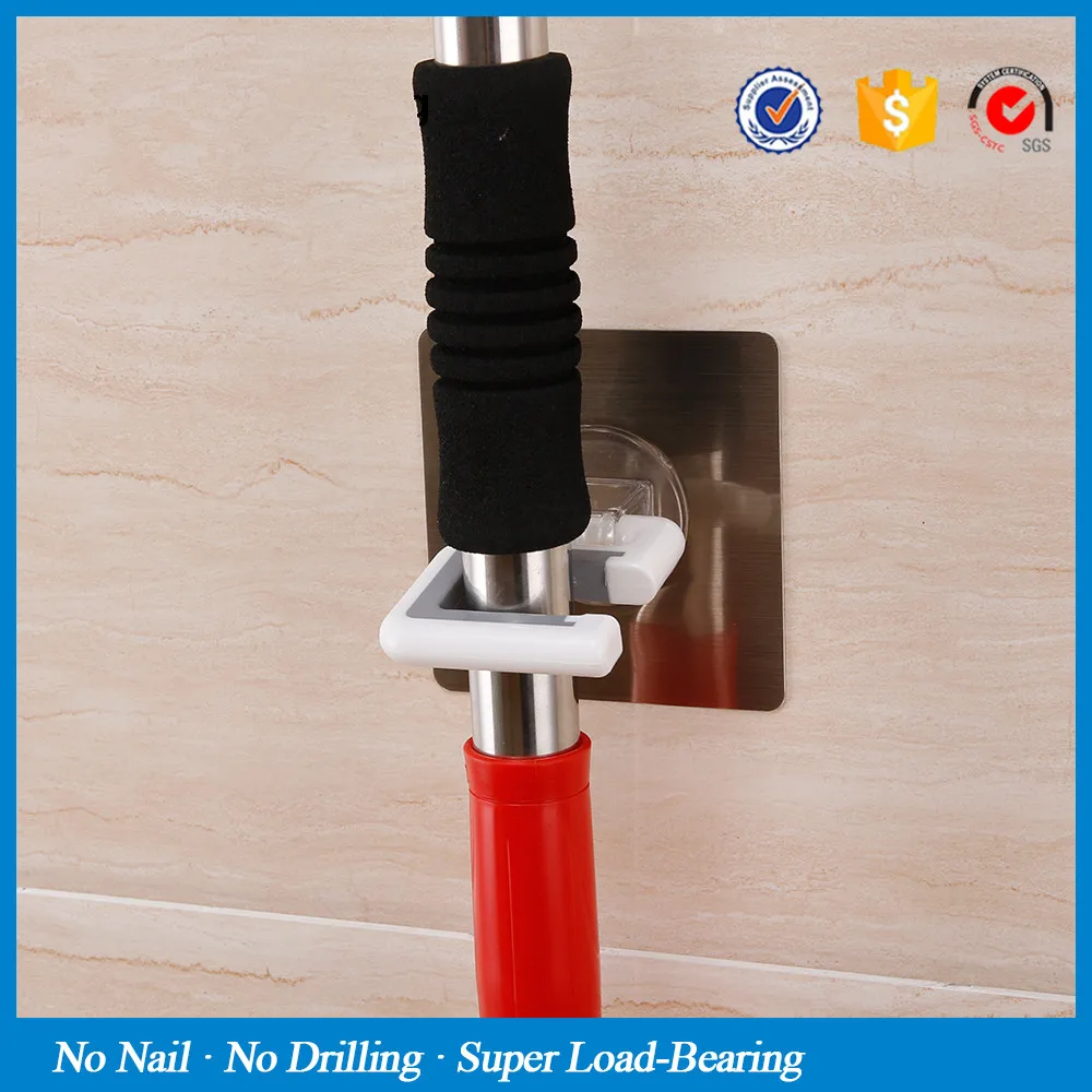wall-mounted-broom-holder-kitchen-bathroom-wall-mop-holder-magic-sticker-max-loading-5kg-broom-mop (1)