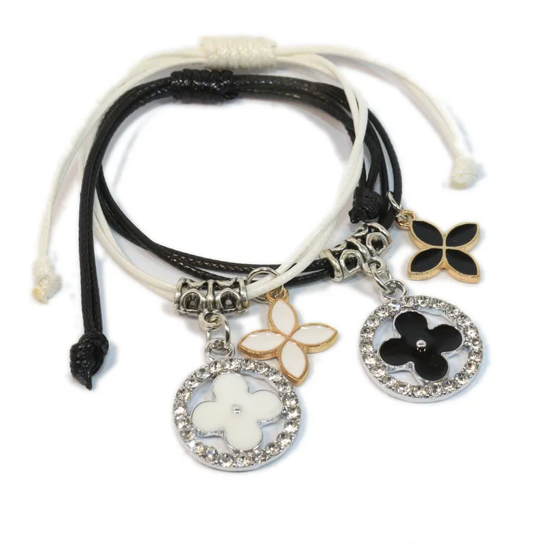 

2PCS Fashion four leaf clovers Bracelet for Women Stylish black and white for lovers Hand-knitted Bracelet Simple Bangles