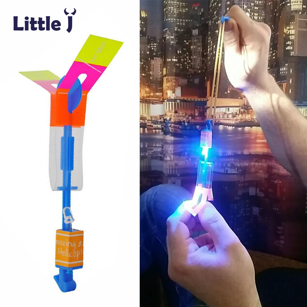 

12Pcs/Lot Amazing LED Light Arrow Rocket Helicopter Rotating Flying Toys Party Fun Kids Outdoor Flashing Toy Fly Arrow