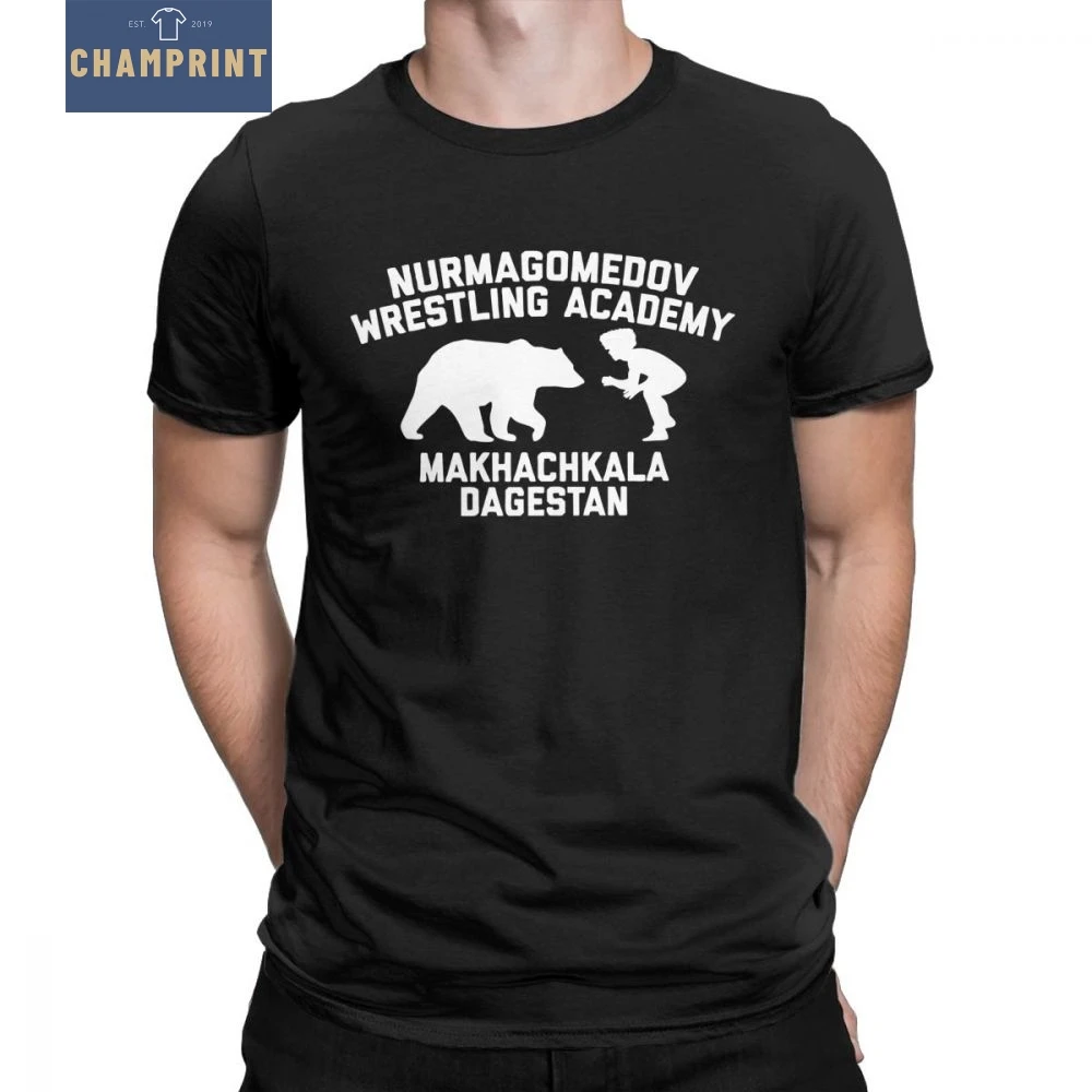 Khabib Nurmagomedov المصارعة أكاديمية تي شيرت للرجال MMA قصيرة الأكمام مضحك تيز Crewneck النقي ملابس قطنية تصميم T قميص Khabib Nurmagomedov المصارعة أكاديمية تي شيرت للرجال MMA قصيرة الأكمام مضحك تيز Crewneck النقي ملابس قطنية تصميم T قميص