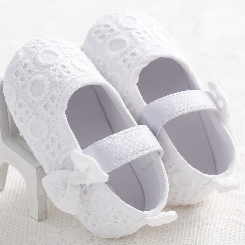 All white infant shoes