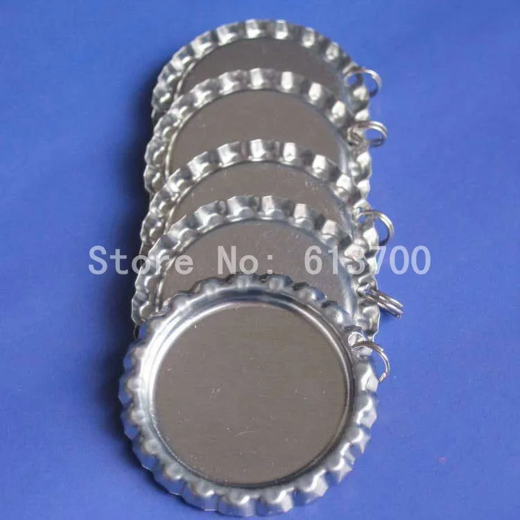 

Free Shipping 2000 pcs/lot Chrome Metal Flattened Bottle Caps bottlecap Sliver colored Linerless with Hole and Ring for Pendant