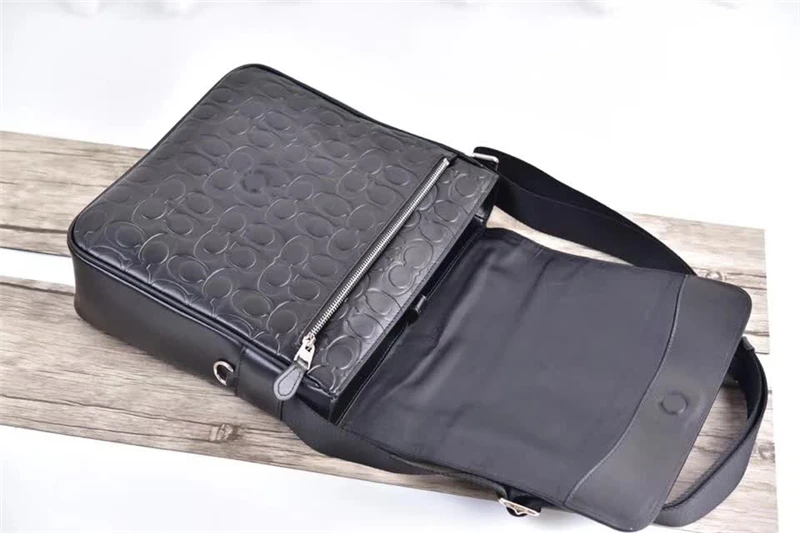 

2018110601 Medium C-grain full leather slanted embossed cowhide leather Large capacity Computer compartment 29*28*9cm