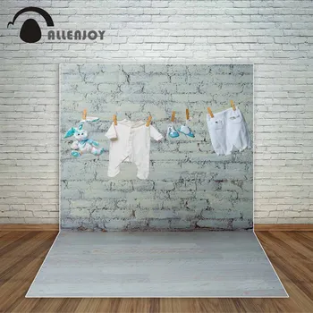 

Allenjoy baby's white and blue shoes onesie panties toy rabbit dry on a rope white brick wall photography backdrops a photo fund