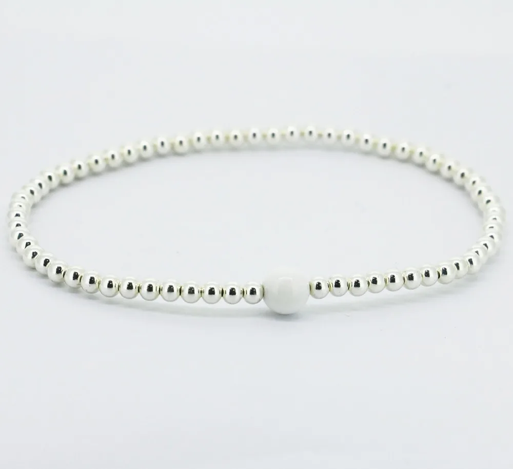 

Solid 4MM Sterling Silver&Tridacna Beads Stretch Bracelet
