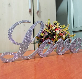 

Crystal scripted "Love" standing sign