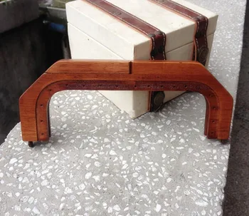

The new rectangular solid antique brass color bag handle accessoies 8.5"*3.5" Wholesale Fashion Sewing Wooden Purse Frame