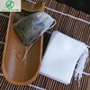 Nuevo bolsitas de té 100 unids/lote 5,5x7CM bolsas de té vacías con cadena de sanar sello de papel de filtro para Herb té Suelto ► Foto 1/4