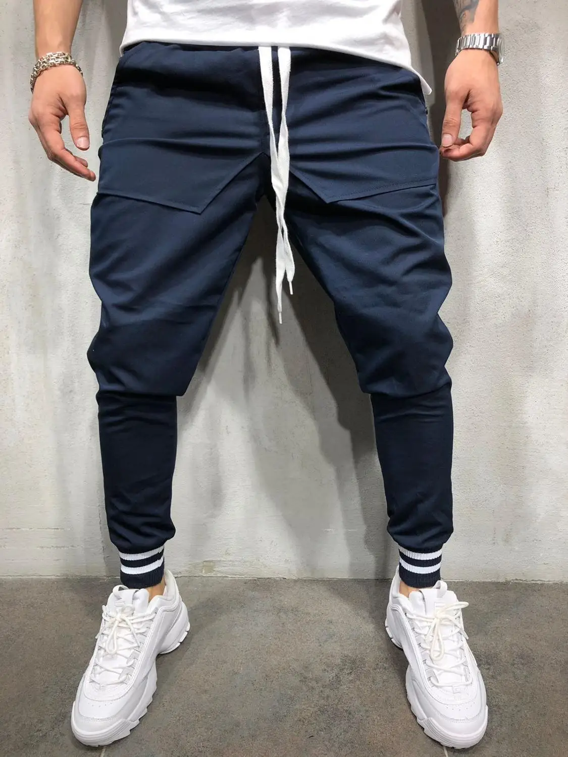 

Men's slacks with elastic waistlines are designed as multi-pocket slacks for casual joggers