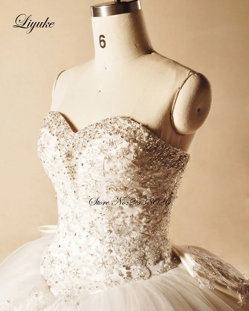 Liyuke элегантный вечернее платье без бретелей свадебное платье с бантом 2019 Бисер аппликации кружева принцесса свадебное платье