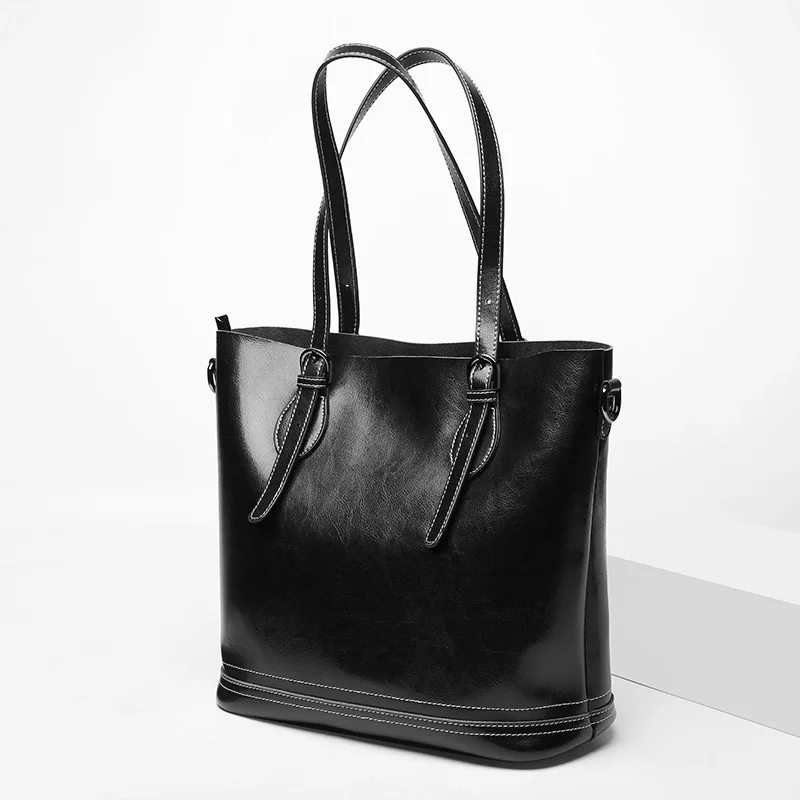 

Women's new retro leather large-capacity handbag Trend leather bucket type vertical loss-proof rivet shoulder bag