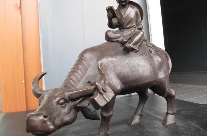 

Chinese Folk Pure Bronze Copper Carved vaquero Boy Nunnery Ride carabao Statue