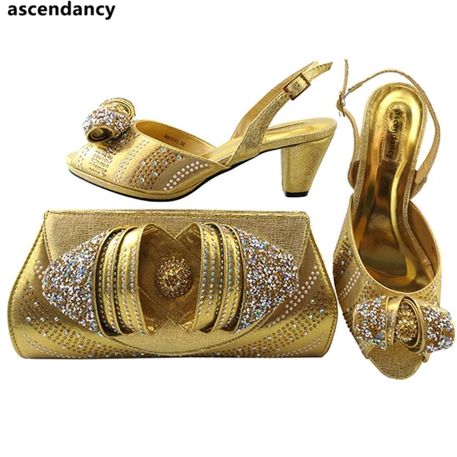 gold sandals and matching bag