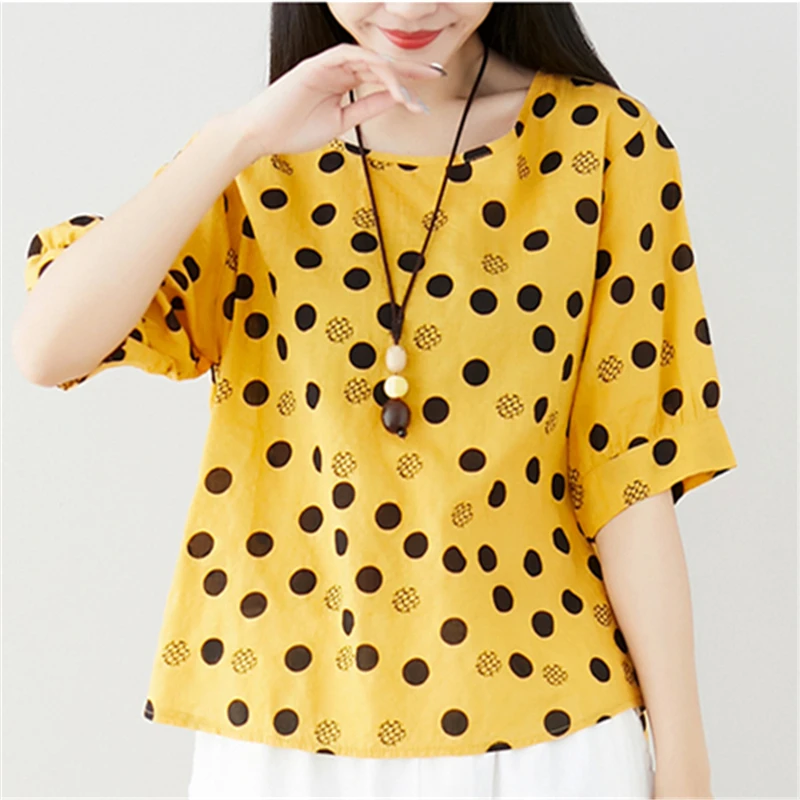 yellow top with black polka dots