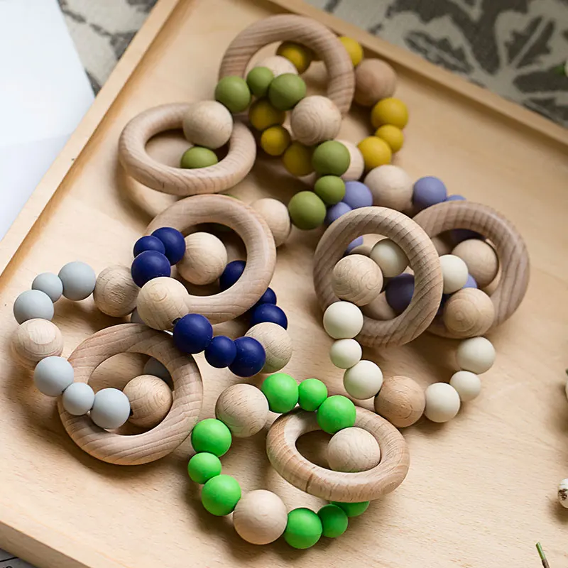 

Food Grad Baby Nursing Bracelets Rattle Silicone Beads Teether Teething Wooden Rattles Toys Baby Teether Bracelets Wood Ring
